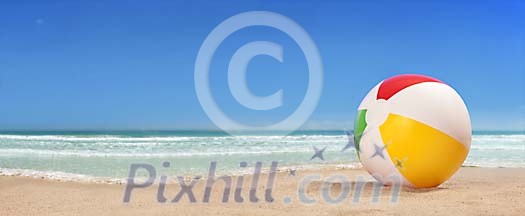 Lonely beach ball on the beach panorama Lonely beach ball on the beach panorama