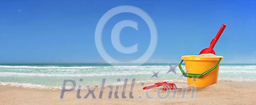 Childrens toys on beach panorama Childrens toys on beach panorama