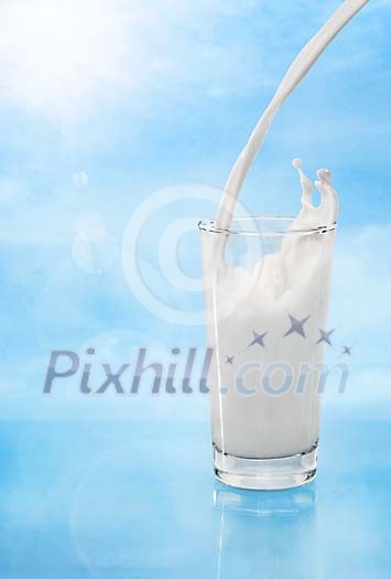 Pouring milk in to glass with nice splashes