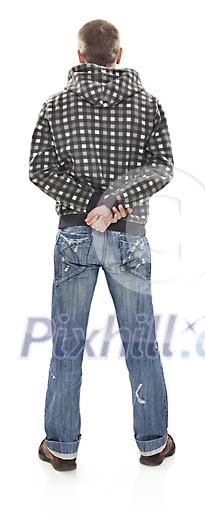 Young man standing back against camera (clipping path included)