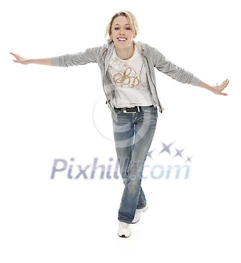 Joyful woman balancing hands spread (clipping path included)