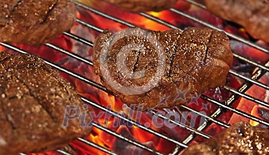 Fillet of beef steaks on a hot grill