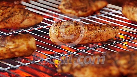 Chicken fillets on hot grill