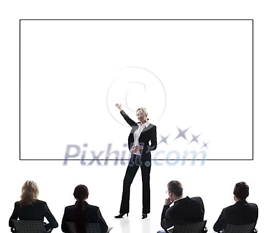 Business woman giving a presentation in front of an empty billboard