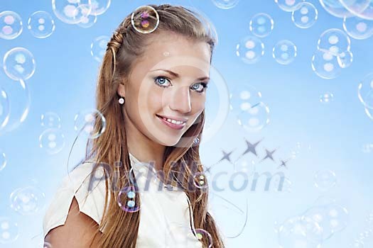 Beautiful girl surrounded by bubbles