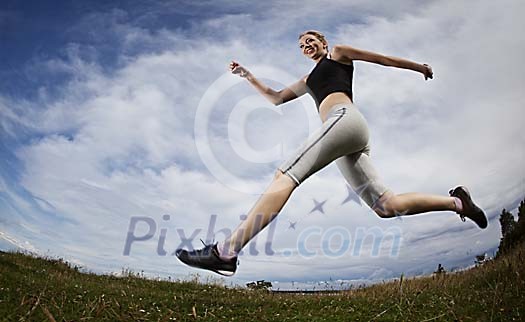 Wide-angle view of a female jogger