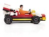 Adult man driving a toy race-car