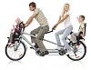 Family of four riding on a custom tandem bike