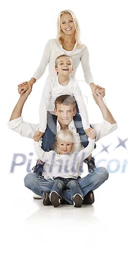 Family of four holding each other