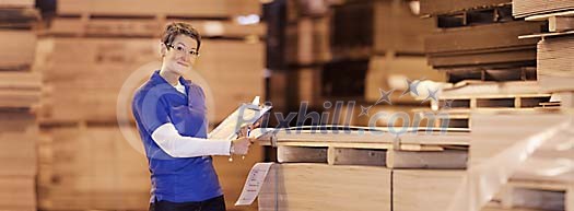 Woman doing inventory in the warehouse