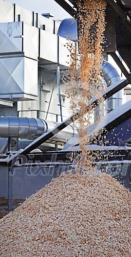 Wood chips falling in industrial process