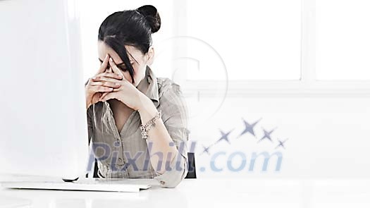 Woman concentrating heavily in front of computer