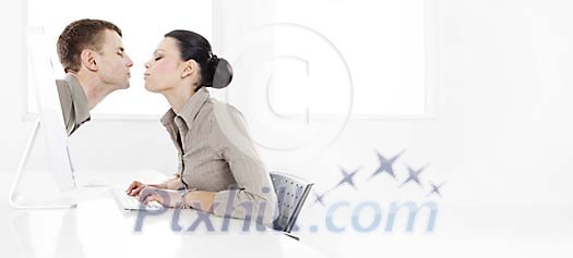 Couple kissing through computer screen Couple kissing through computer screen