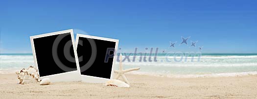 Two polaroids on a sandy beach