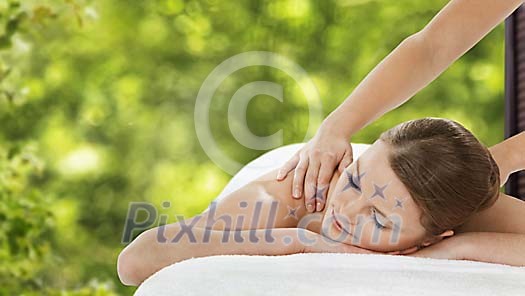Woman getting a shoulder massage
