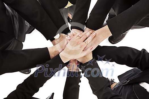 Group of people stacking their hands together