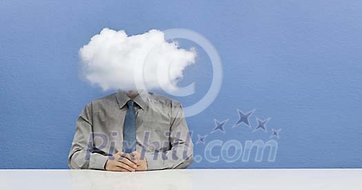 Man sitting with head in the cloud Man sitting with head in the cloud