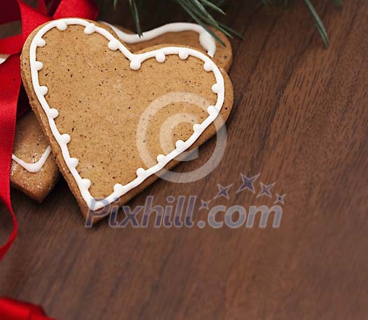 Gingerbread hearts on a wooden background
