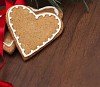 Gingerbread hearts on a wooden background