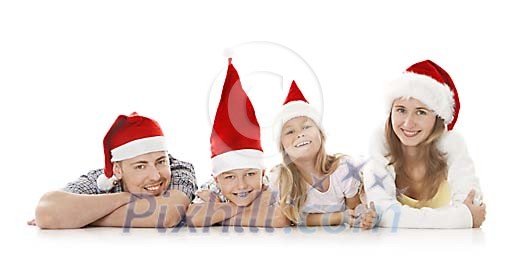 Family lying on white floor dressed for christmas