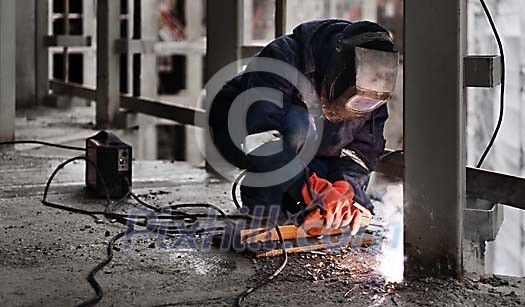 Man welding at the construction