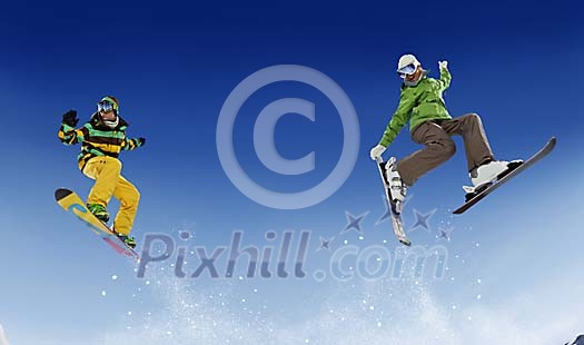 Pair skiing and snowboarding