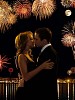 Couple kissing by fireworks