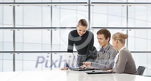 People sitting at the desk having a meeting