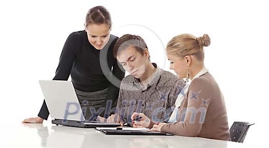 Three people at the desk having a meeting