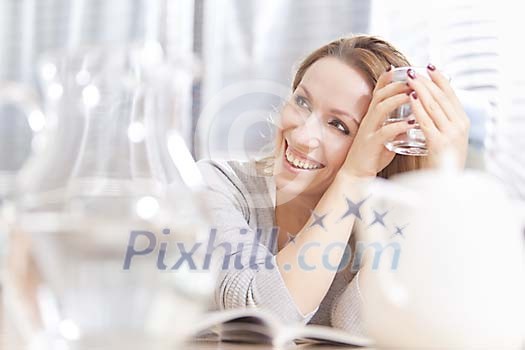 Woman smiling at the table Woman smiling at the table