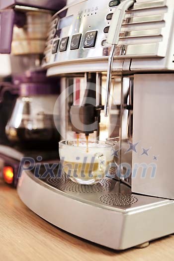Close up of a coffee maker making coffee