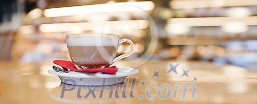 Closeup of a cup of cappucino on the table