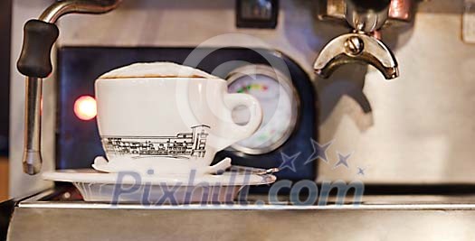 Closeup of the cappucino at the machine Closeup of the cappucino at the machine