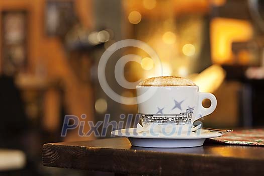 Closeup of a cappuccino with golden foam