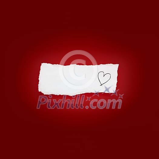 Piece of white paper with heart on a red background