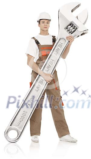 Clipped man standing with oversized wrench