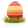 Striped easter egg on the grass