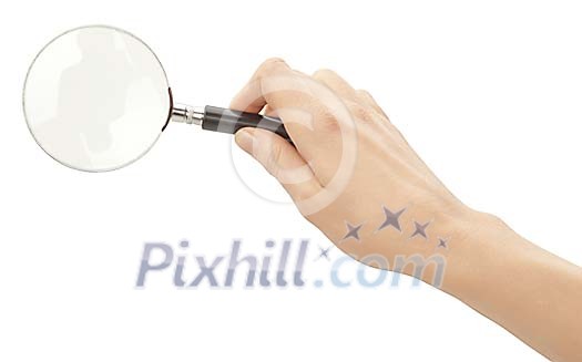 Clipped female hand with magnifying glass