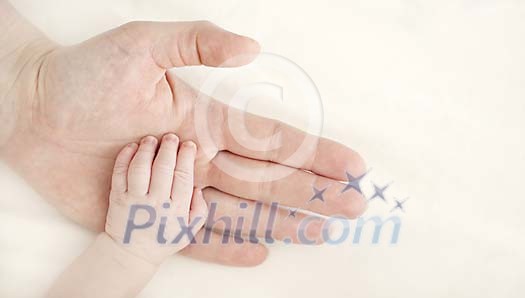 Baby hand on mamas hand Baby hand on mamas hand