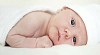 Baby lying on white blankett