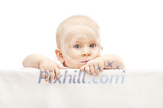 Baby boy peeking over the wall Baby boy peeking over the wall