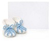White empty card with baby boy shoes