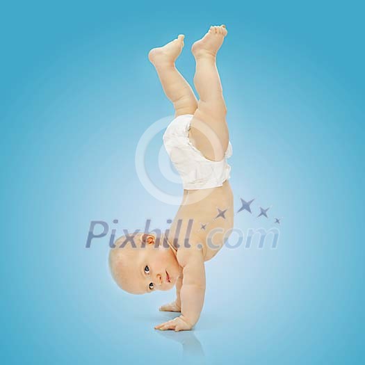 Baby boy standing on his hands Baby boy standing on his hands