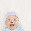 6 month year old baby boy with a big smile