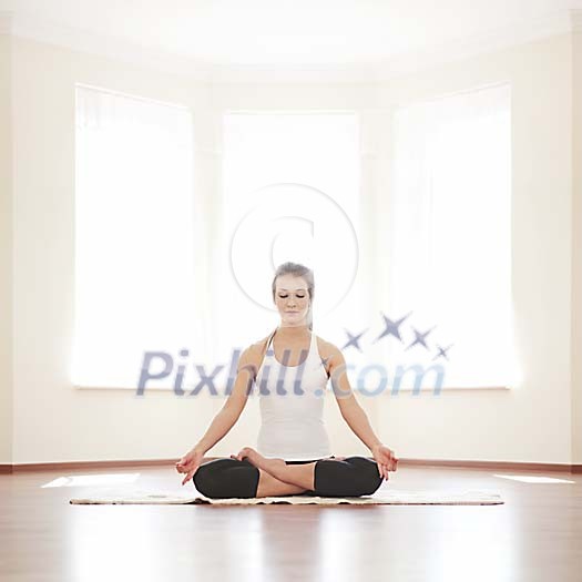Woman meditating on the floor