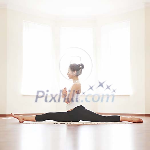 Woman doing splits on the floor