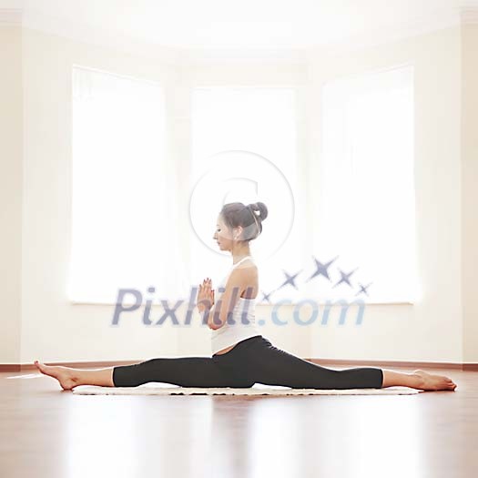 Woman doing splits on the floor Woman doing splits on the floor