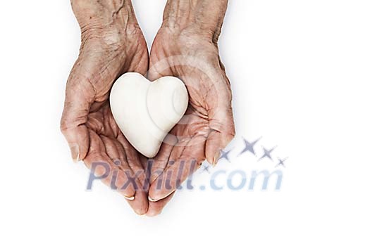 Clipped old hands holding a heart