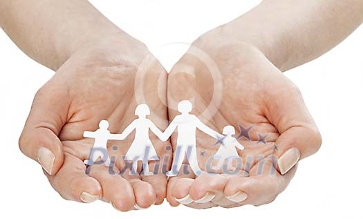 Female hands holding a paper cut out family