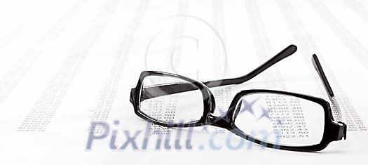 Eyeglasses on number printout Eyeglasses on number printout